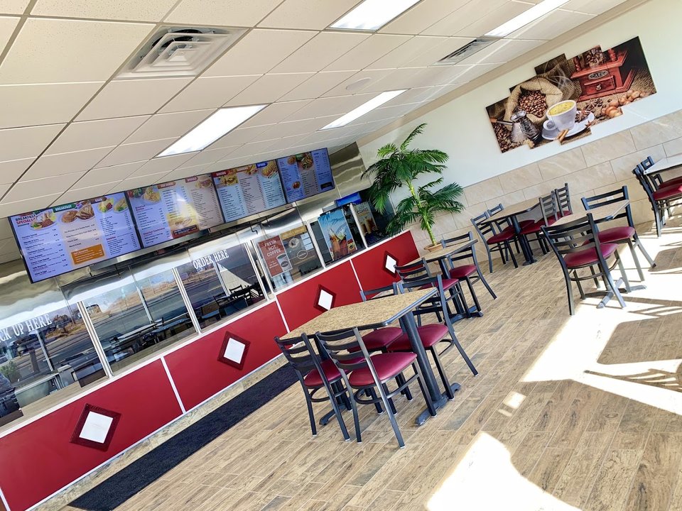 Bright interior seating for breakfast, lunch, and dinner.